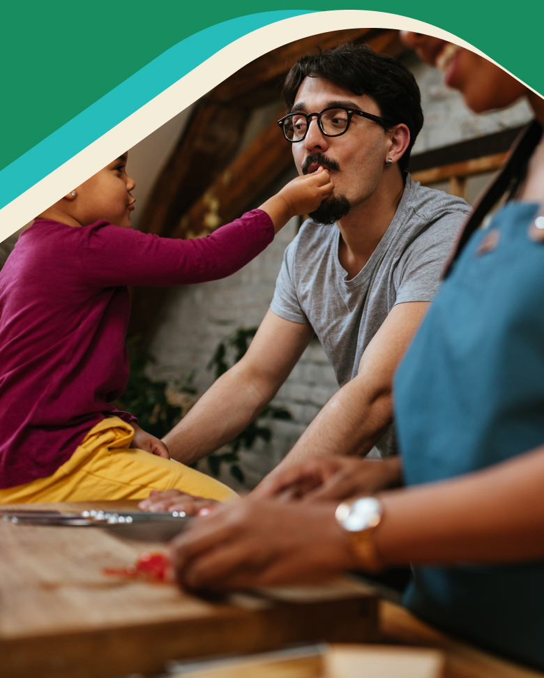 Photo: Parents cooking with child