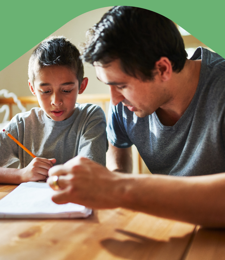 Photo: Father helping child with homework