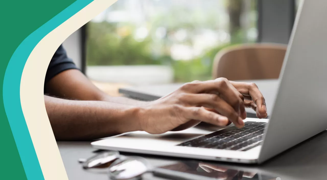 Photo: Parent typing on laptop