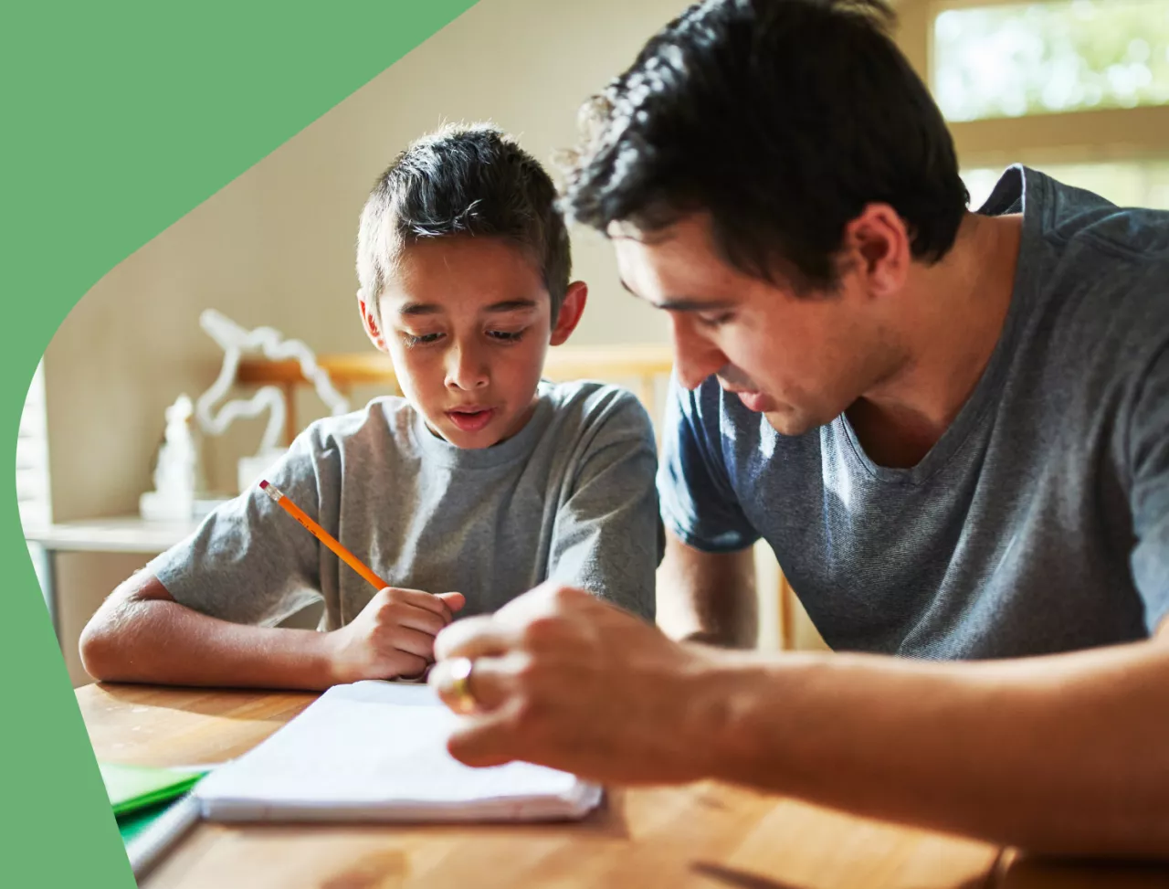 Photo: Father helping child with homework