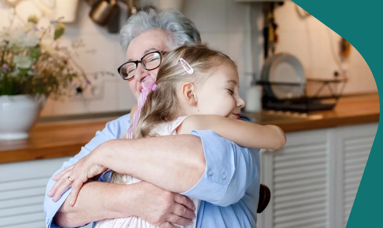 Photo: Grandparent hugging child