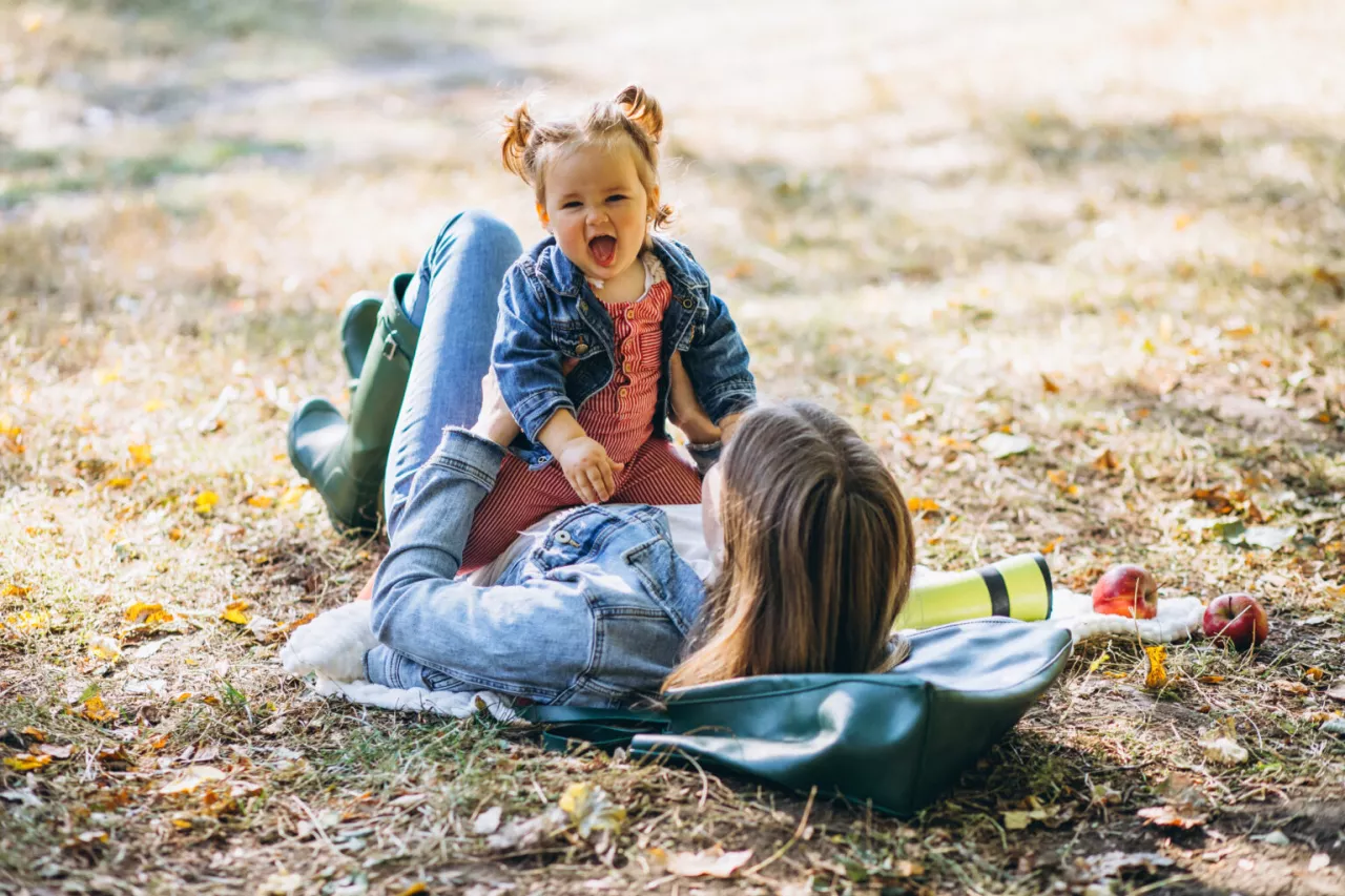 Photo: Mother and child playing in park